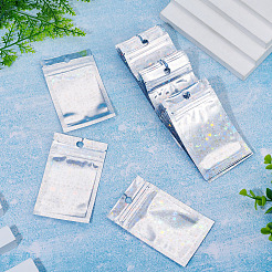 キラキラ輝くホログラフィックスター柄のプラスチック製包装袋（陰陽柄）、再封可能。60個入り。  トップセルフシールパウチ  長方形  銀  10x6x0.01cm  片側の厚さ：2.5ミル（0.065mm）&nbsp;OPP-TA0001-24B