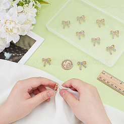 バックパックの服に使える蝶結び形の合金ラインストーンブローチ10個。  ゴールドカラー  19x20.5mm&nbsp;JEWB-PH0001-40